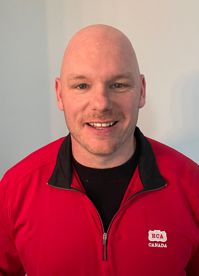 bald man smiling on a white background